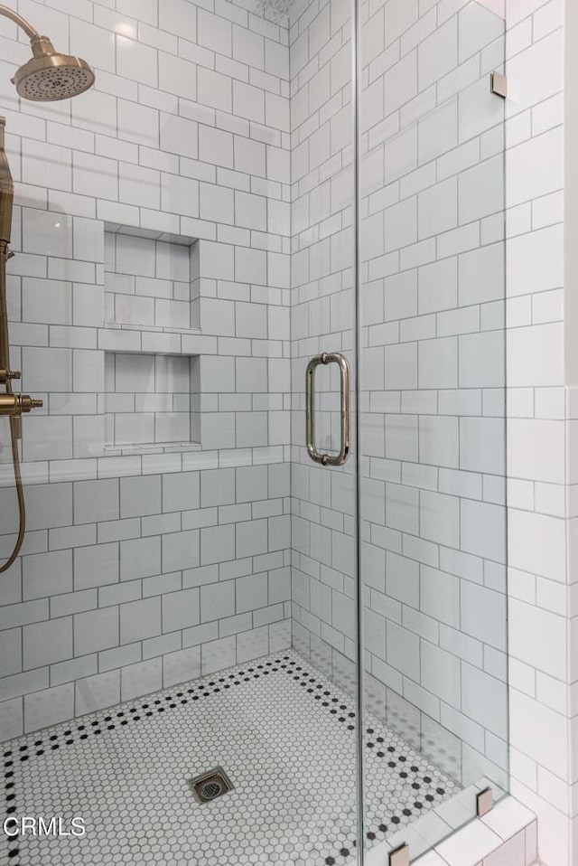 bathroom with a shower stall