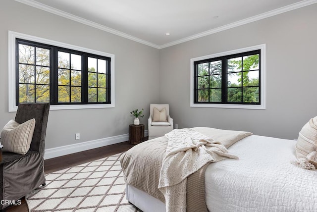 bedroom featuring crown molding, baseboards, wood finished floors, and recessed lighting