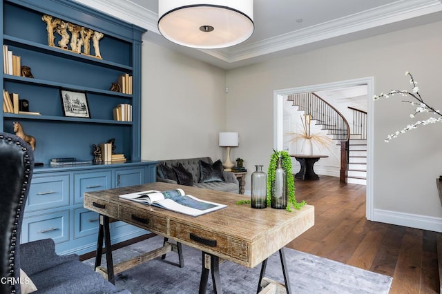 home office with baseboards, dark wood-style flooring, built in features, and crown molding