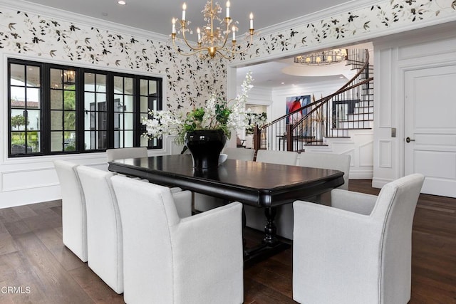 dining room with dark wood-style floors, a decorative wall, stairway, and crown molding