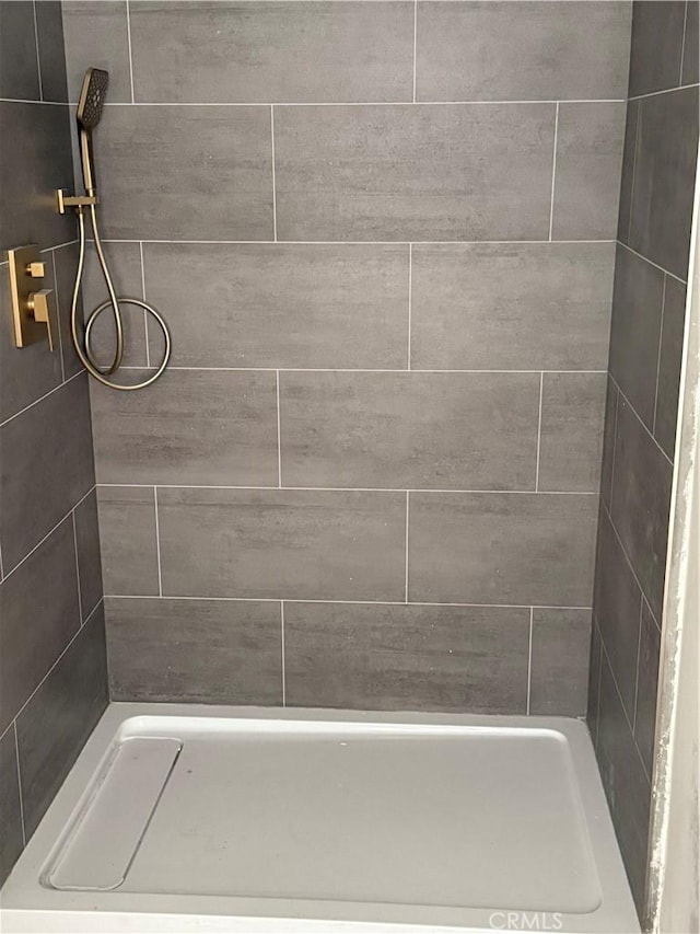 bathroom featuring a stall shower