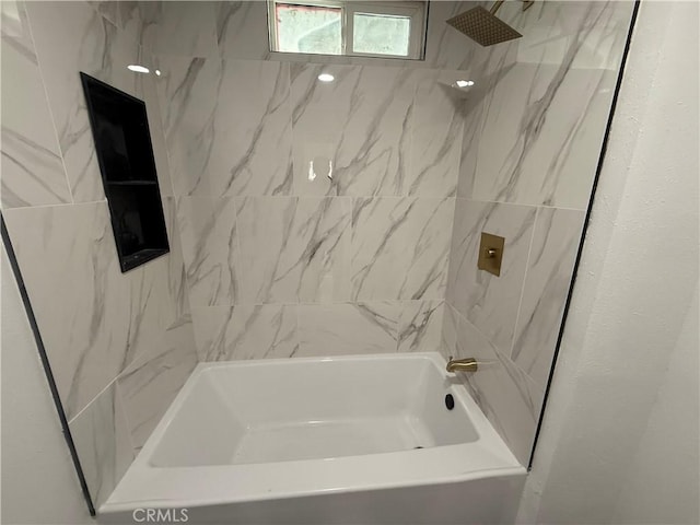 bathroom with shower / washtub combination