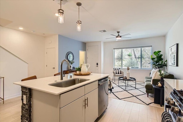 35107 Rangpur Ln, Fallbrook, CA 92028 - kitchen featuring a sink, dishwasher, open floor plan, range with gas stovetop, and light countertops