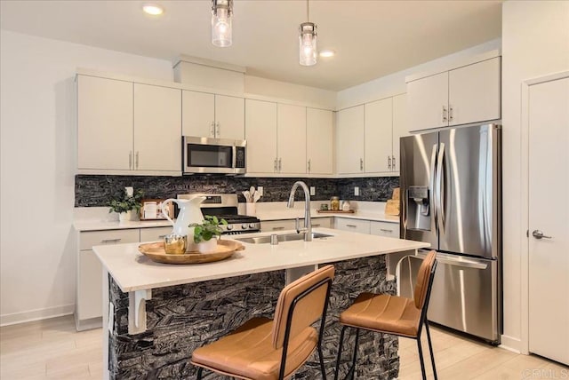 35107 Rangpur Ln, Fallbrook, CA 92028 - kitchen featuring appliances with stainless steel finishes, a sink, decorative backsplash, light countertops, and recessed lighting