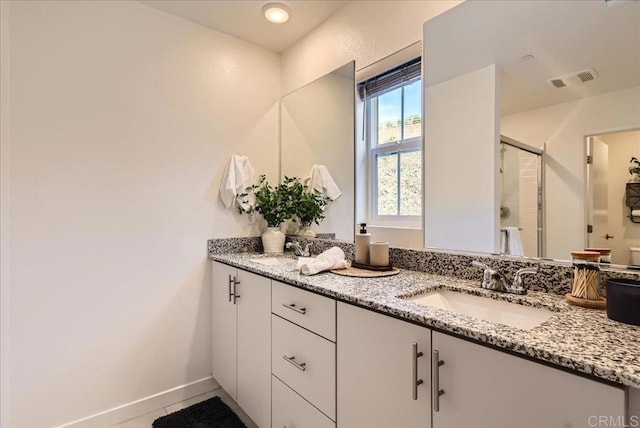 35107 Rangpur Ln, Fallbrook, CA 92028 - bathroom with double vanity, a stall shower, tile patterned flooring, and baseboards