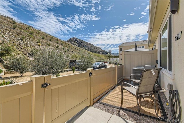 35107 Rangpur Ln, Fallbrook, CA 92028 - view of patio / terrace featuring a mountain view, a gate, and central air condition unit