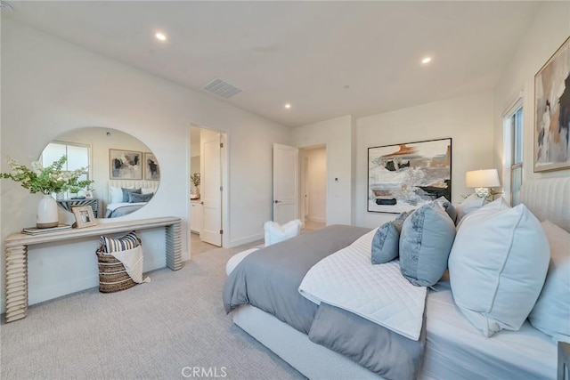 bedroom with connected bathroom, recessed lighting, light carpet, visible vents, and baseboards