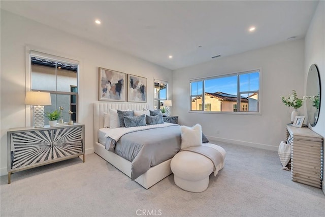 bedroom featuring baseboards, recessed lighting, visible vents, and light colored carpet