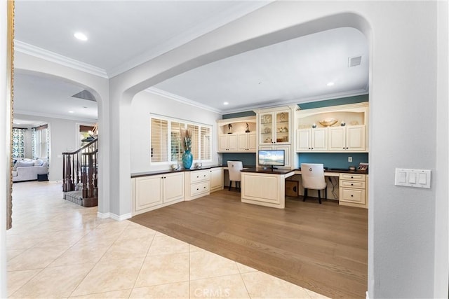 office featuring ornamental molding, recessed lighting, built in desk, and light tile patterned floors