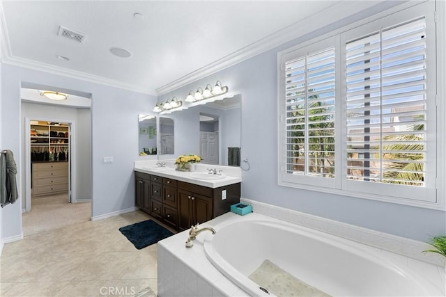 bathroom featuring double vanity, visible vents, a garden tub, crown molding, and a sink