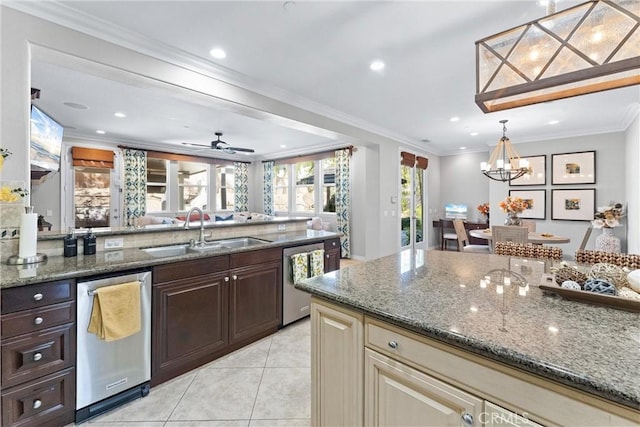 kitchen featuring dishwasher, a sink, and crown molding