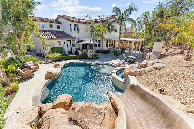 outdoor pool with a patio area