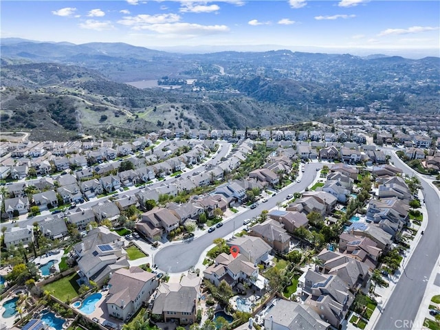 drone / aerial view featuring a mountain view and a residential view