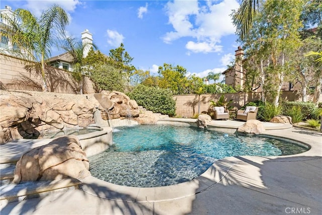 view of swimming pool featuring a fenced in pool, a patio area, and a fenced backyard