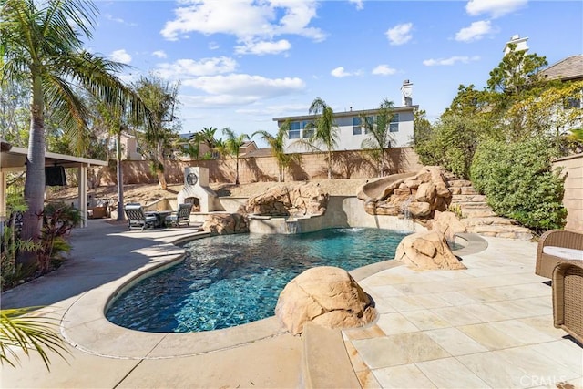 view of pool featuring a fenced backyard, a fenced in pool, and a patio