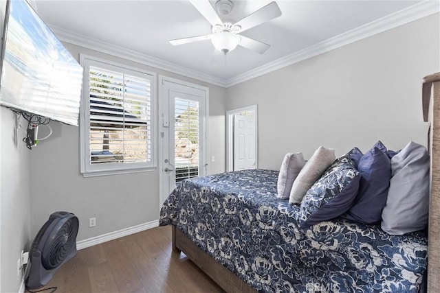 bedroom featuring access to outside, ornamental molding, wood finished floors, and baseboards