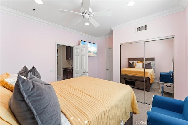 bedroom featuring carpet flooring, visible vents, and crown molding