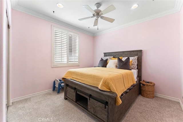 bedroom featuring light carpet, ornamental molding, a ceiling fan, and baseboards