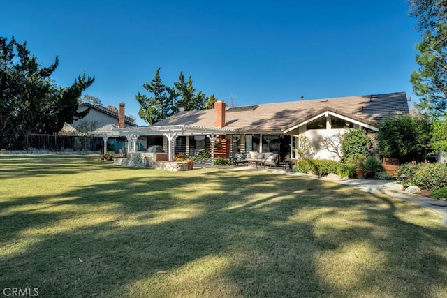 rear view of house with a yard, a chimney, a patio, fence, and a pergola