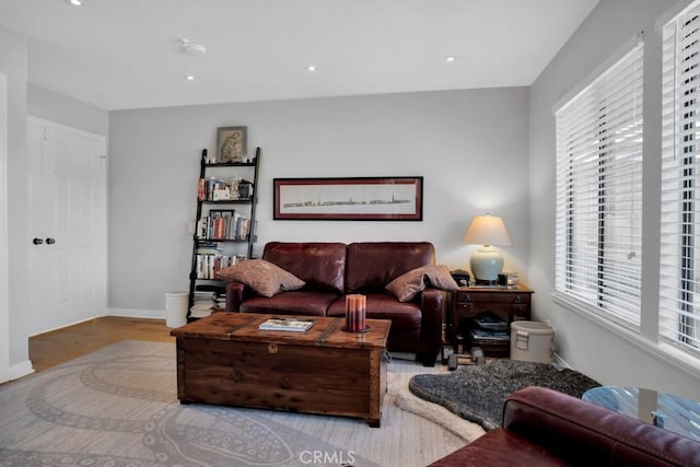 living area featuring recessed lighting, light wood-style flooring, and baseboards