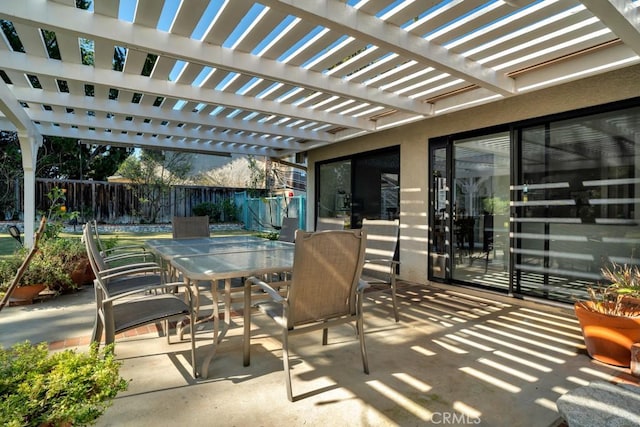 view of patio / terrace featuring outdoor dining space, fence, and a pergola