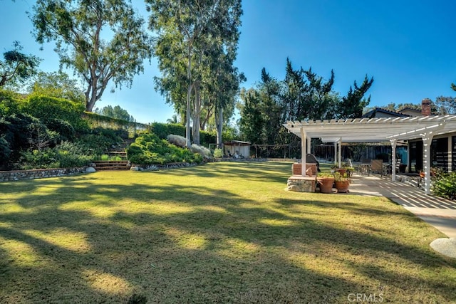 view of yard with a patio and a pergola