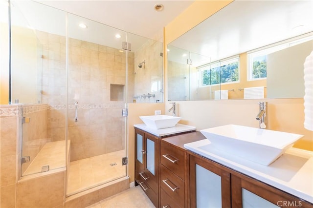 bathroom featuring double vanity, recessed lighting, a sink, and a shower stall