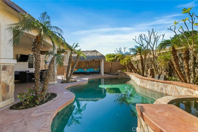 view of pool featuring a fenced in pool, a patio, and fence