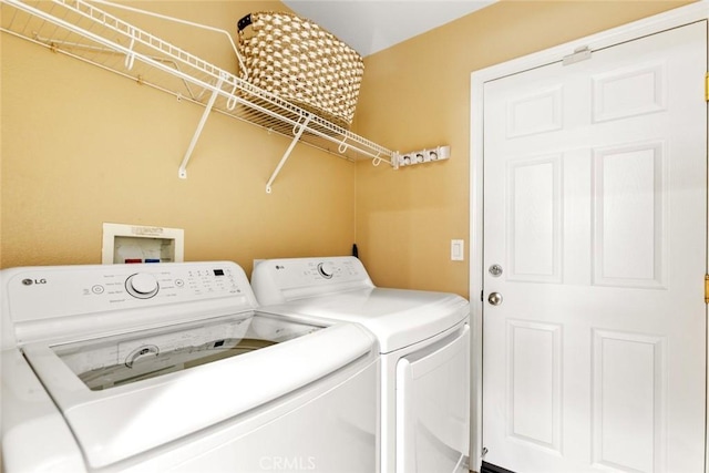 laundry area featuring laundry area and independent washer and dryer