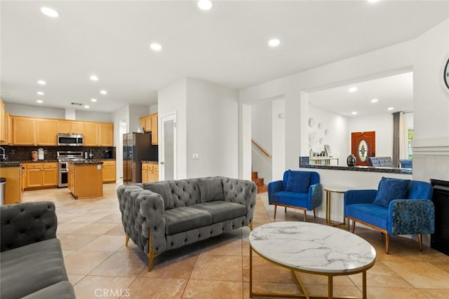 living area with stairway and recessed lighting