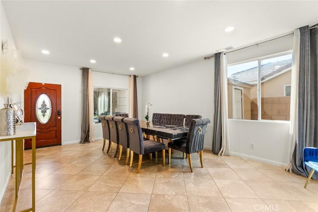 dining room featuring light tile patterned floors, baseboards, and recessed lighting