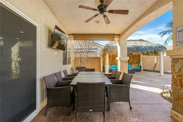 view of patio / terrace featuring ceiling fan, outdoor dining area, an outdoor hangout area, and a fenced backyard