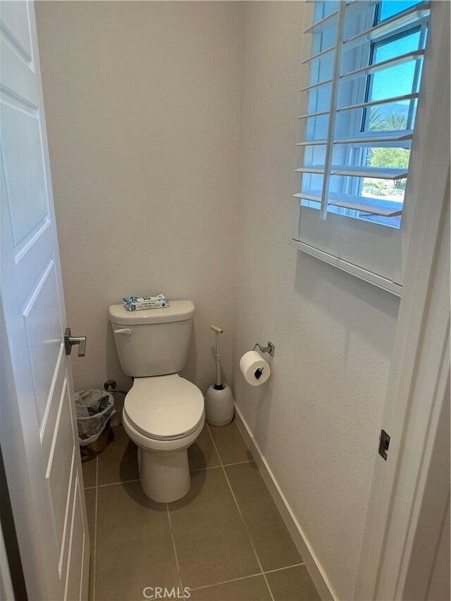 13906 Gazania Ln, Fontana, CA 92336 - bathroom with tile patterned floors and toilet