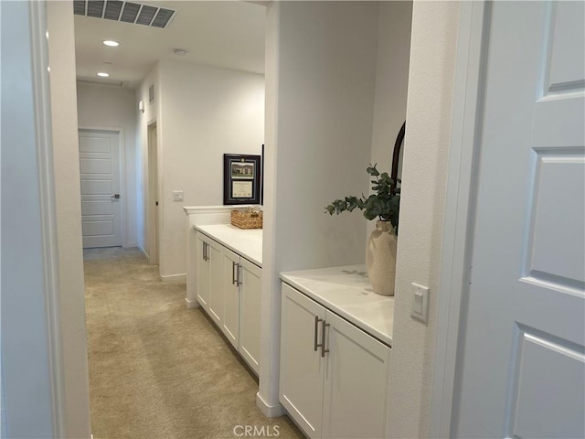 bathroom with recessed lighting, visible vents, vanity, and baseboards