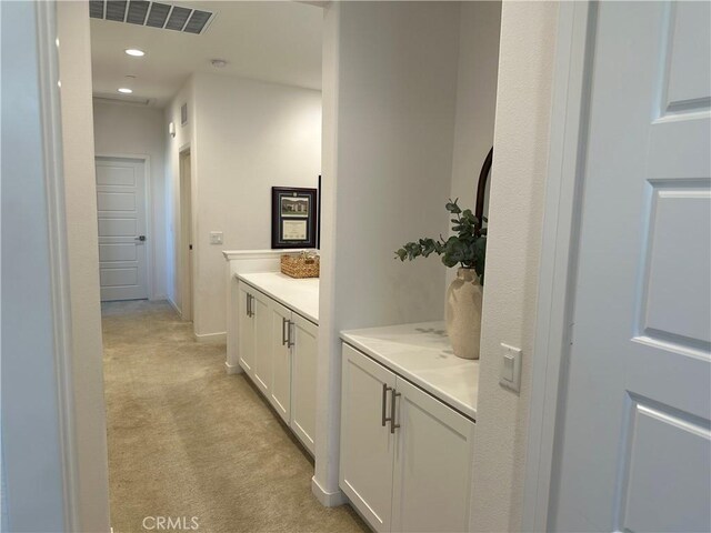 13906 Gazania Ln, Fontana, CA 92336 - hall with light colored carpet and recessed lighting