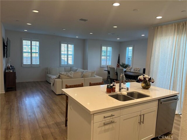 13906 Gazania Ln, Fontana, CA 92336 - kitchen featuring open floor plan, stainless steel dishwasher, wood finished floors, and recessed lighting