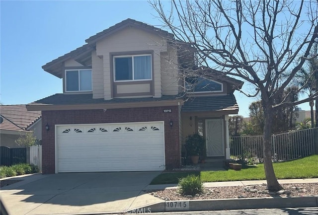 traditional-style home featuring concrete driveway, brick siding, and fence