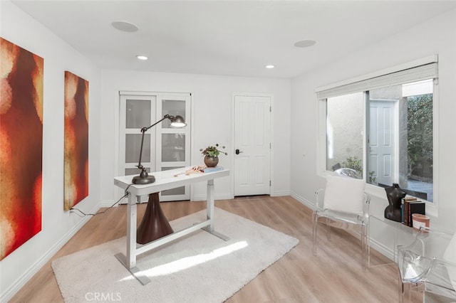 office area with recessed lighting, light wood-style flooring, and baseboards