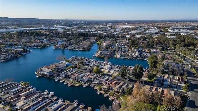 bird's eye view featuring a residential view and a water view