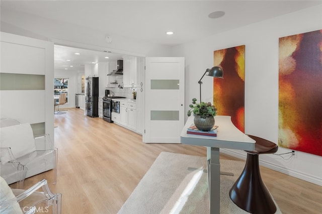 foyer entrance with light wood-type flooring, baseboards, and recessed lighting