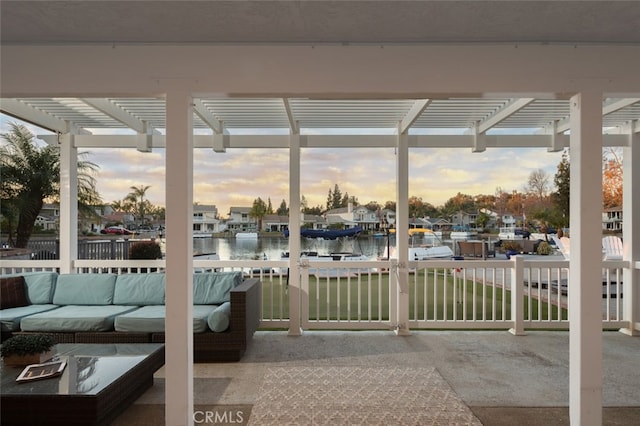 unfurnished sunroom with a water view