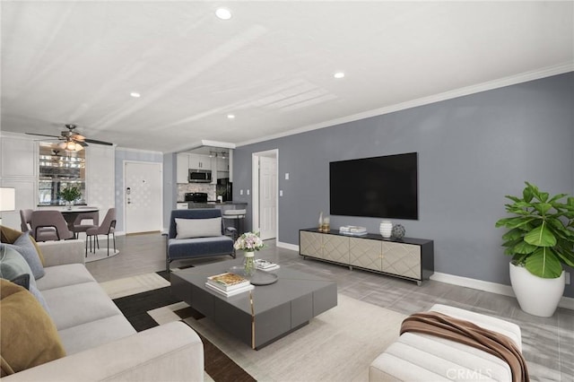 living room with ornamental molding, recessed lighting, and baseboards