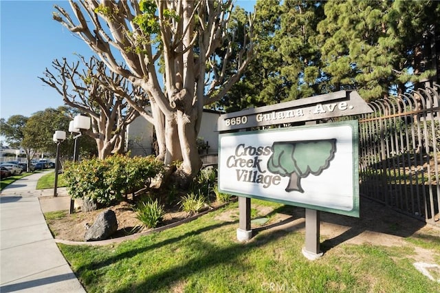 community sign with fence