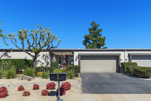 view of front of house with a garage and concrete driveway