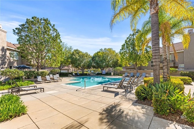 community pool featuring a patio area