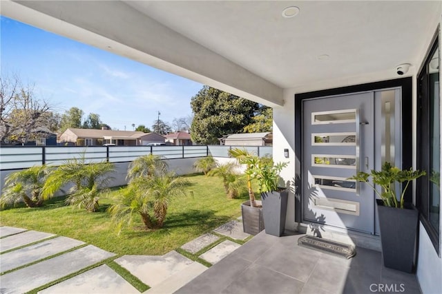 view of patio featuring fence