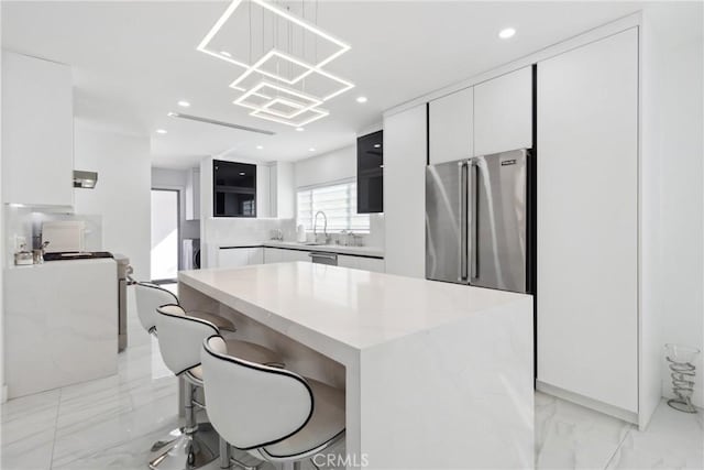 kitchen with white cabinets and light countertops