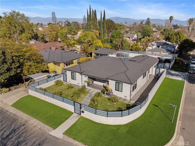 birds eye view of property with a residential view and a mountain view