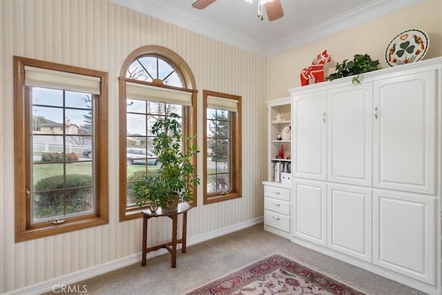 interior space featuring ornamental molding, light colored carpet, baseboards, and wallpapered walls