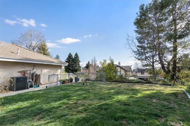 view of yard with cooling unit and fence